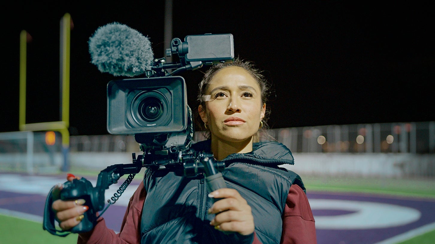 Woman using video camera