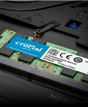 A macro shot of Crucial DDR4 SODIMM installed in a laptop.