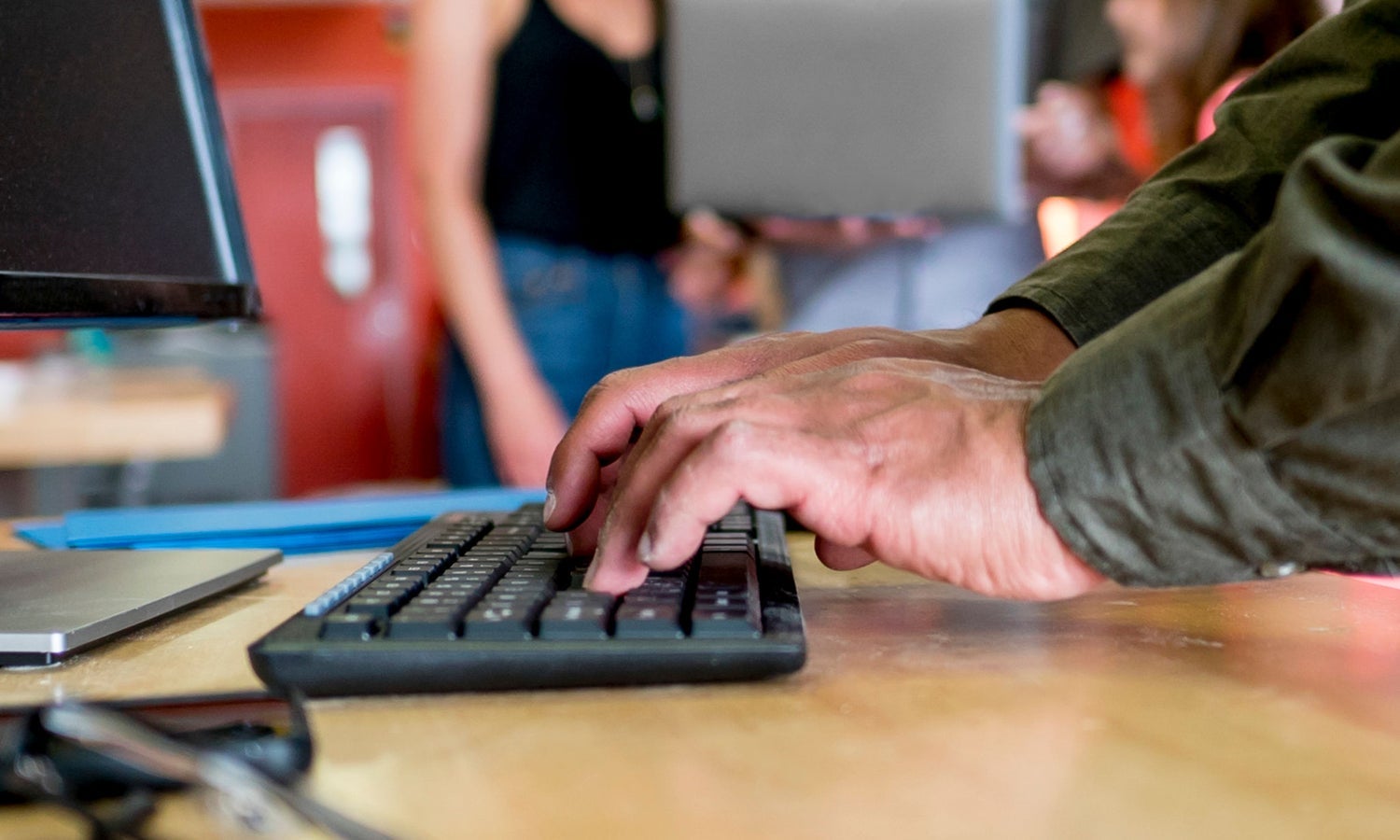 Person typing at keyboard